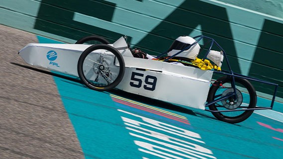 close-up of electrathon racer in their car on the track