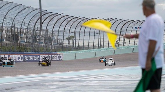 electrathon racers driving to finish line