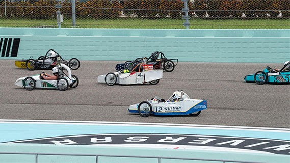 electrathon racers driving around racetrack