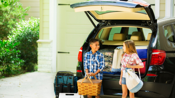 two children packing car