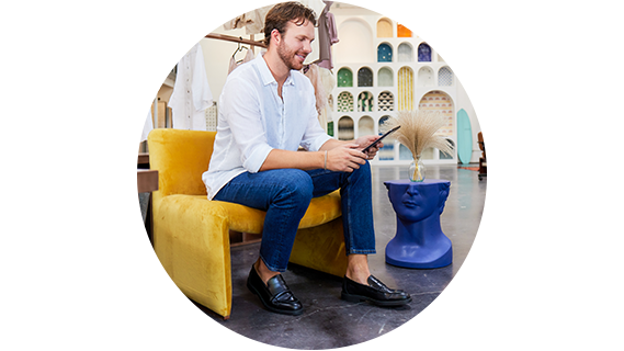 a business owner sitting and using a tablet