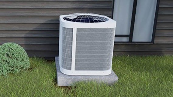 ac unit sitting on pad in grass