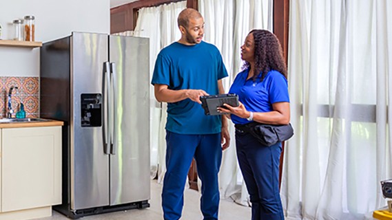 man and woman in kitchen